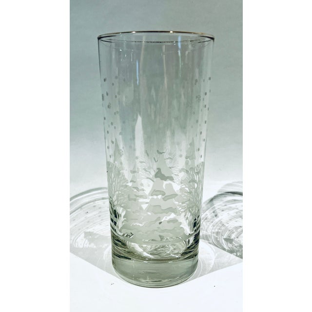 Adorable set of 4 vintage Libbey White Trees/Pines high ball glasses with gold rims. Falling snow on the trees makes this...