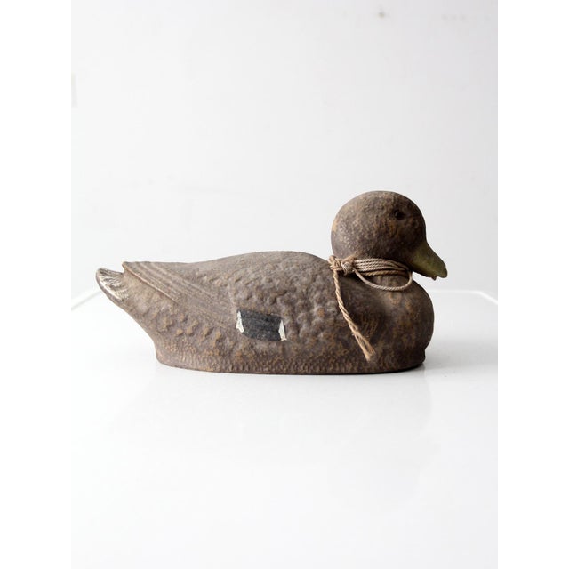 This vintage JC Higgins hen mallard decoy dates to the mid-20th century and features a softly rounded silhouette, subtle...