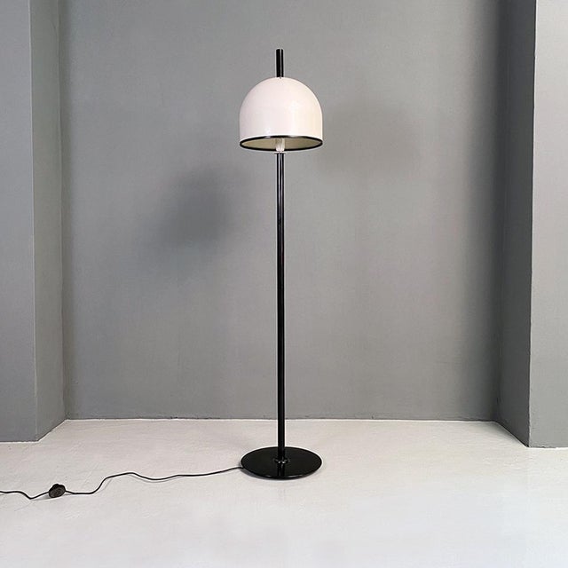Italian post modern black metal stem and white metal lampshade floor lamp, 1980s. Floor lamp with black stem and white...