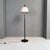 Italian post modern black metal stem and white metal lampshade floor lamp, 1980s. Floor lamp with black stem and white...