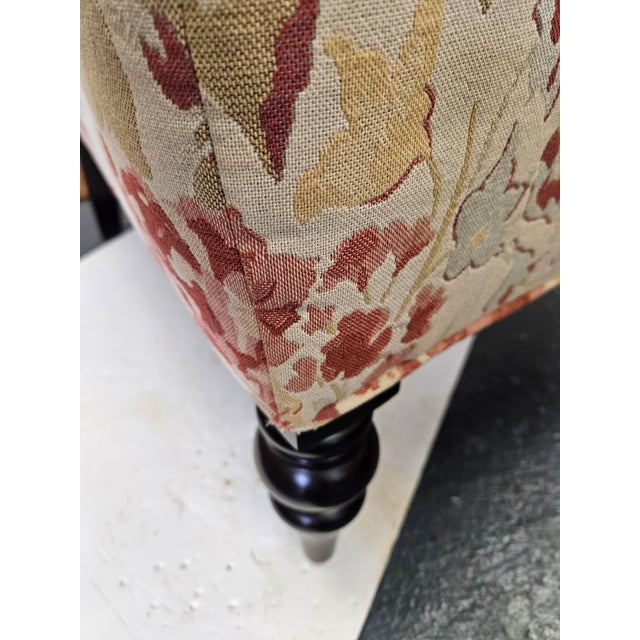 Charming floral slipper chair with ebonized feet. Excellent condition and quality.