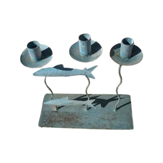 Eye-catching Fun distressed metal with a blue/green tone candle holder with fish.