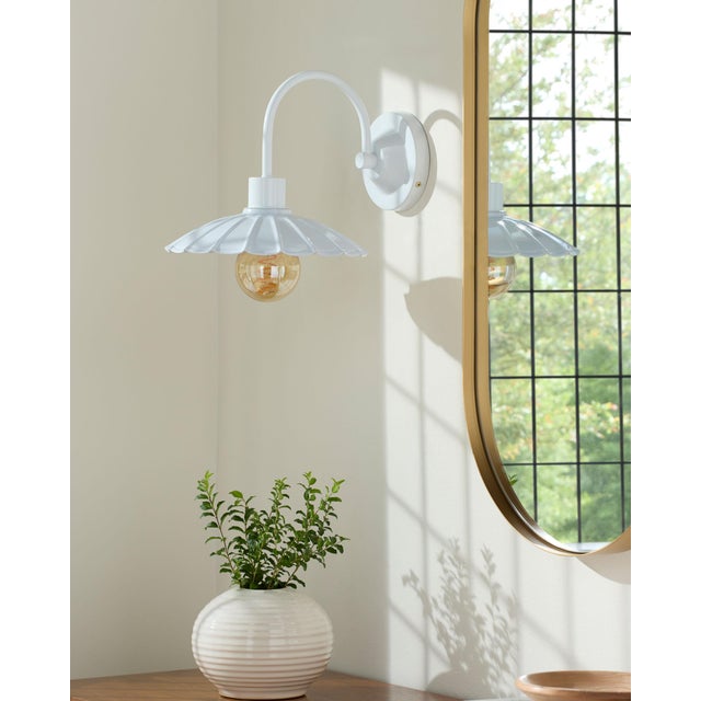 Illuminate your space with the rugged charm of the Pavona wall sconce lighting, where industrial meets rustic in a...