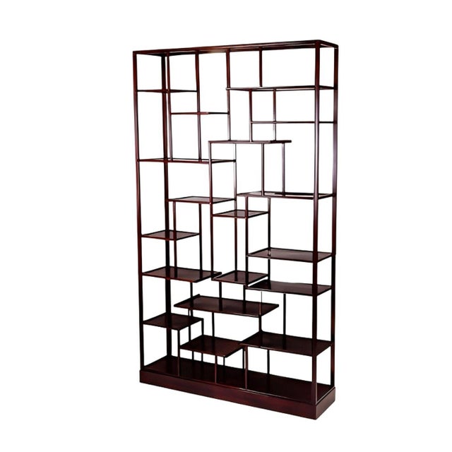 An exceptional and monumental pair of early 20th century Chinese rosewood étagères, dating to the Art Deco period, circa...