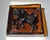 A striking Mid-Century glass object of Polish origin. Crafted from solid, cast amber colored glass. It is rectangular in...