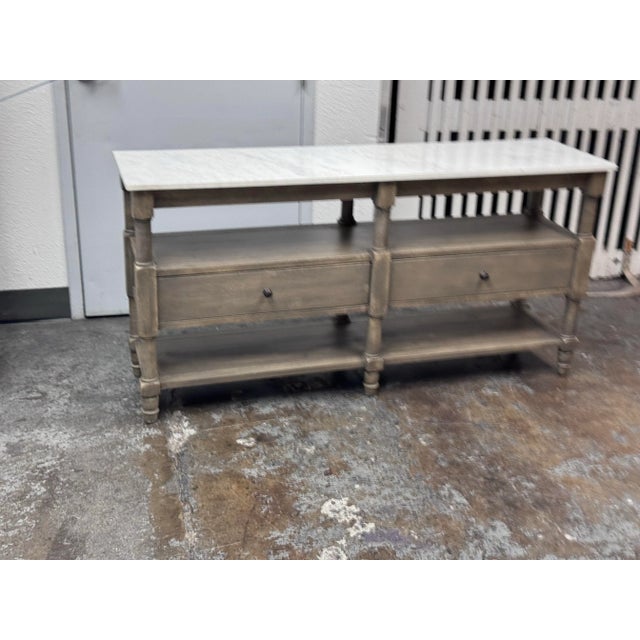 Design Plus Gallery presents the Alexandra Marble Console Table by Williams-Sonoma for Pottery Barn. The base on this...