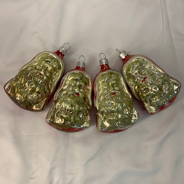 These ornaments are highly collectible because of their classic hand-blown German style, molded textured details, and...