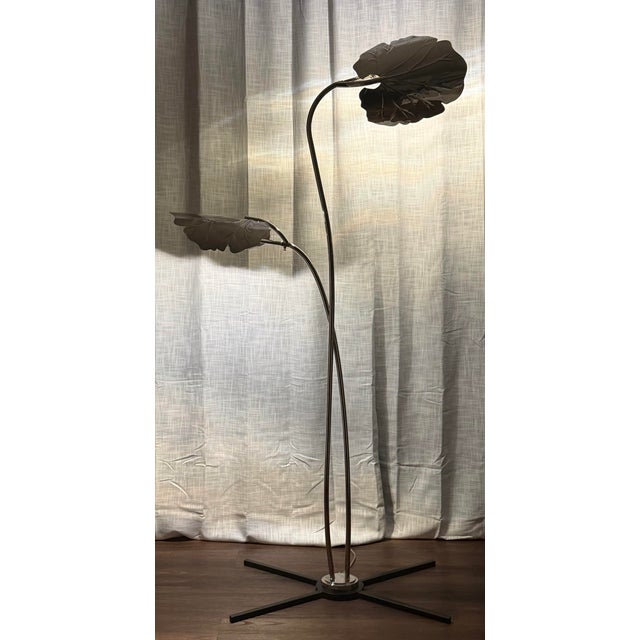 The sculptural Global Views Rimini Floor Lamp brings a refined organic presence to any interior with its fluid stem and...