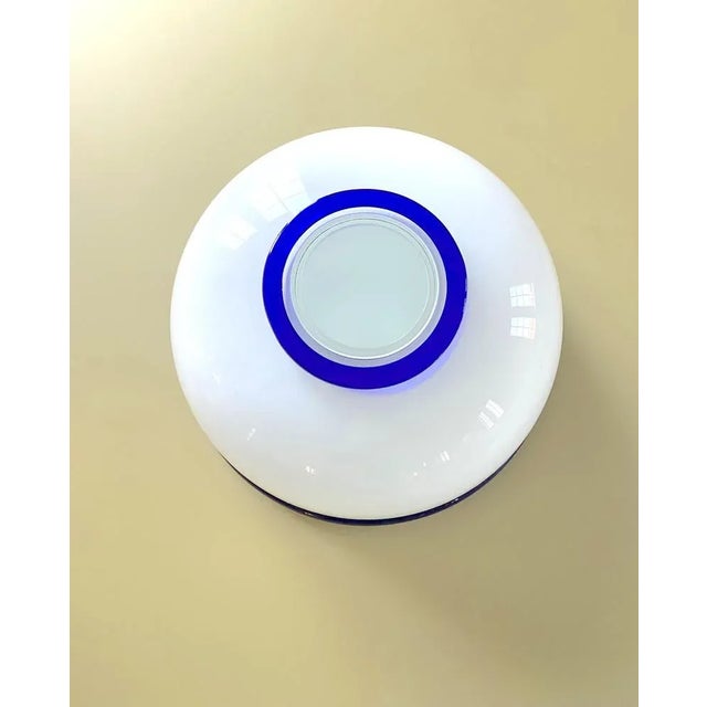 Hemiferous vase in opal glass with mouth and cord applied in transparent blue glass I have official proof of authenticity...