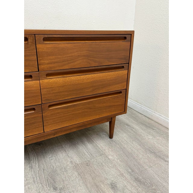 Beautiful mid century modern walnut dresser manufactured by American of Martinsville, professionally restored.