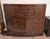 This gentleman’s chest combines handsome burled-finish surfaces with a gently curved front, offering a generous mix of...