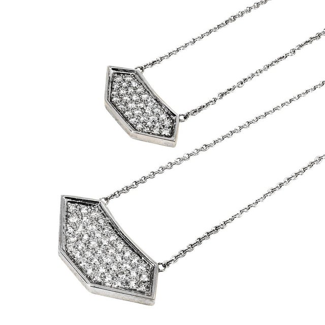 14k White gold 19" cable link necklace with suspended sheild shape medallion set with 42 round brilliant diamonds weighing...