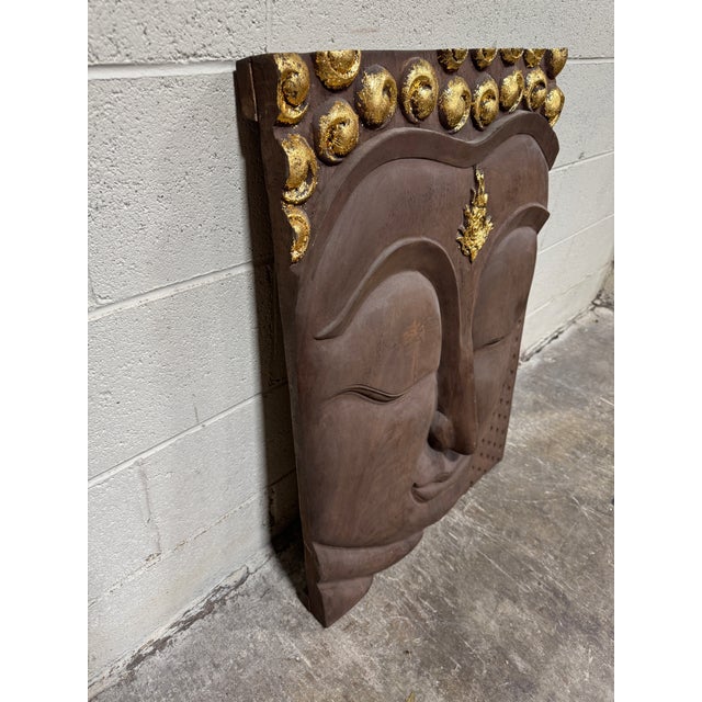 I personally purchased this 20 some years ago. Heavy thick acacia wood carved buddha face with gold leaf at the top. Gold...
