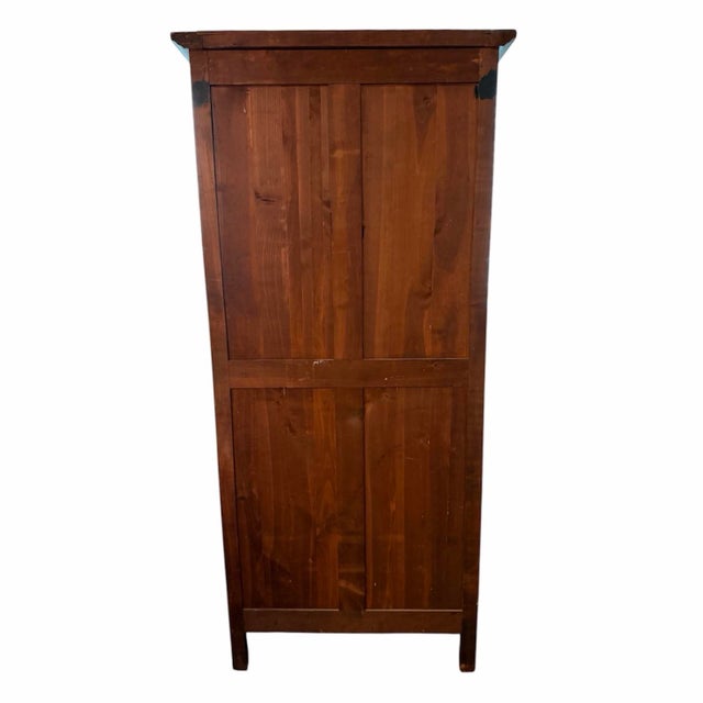 French provincial walnut vitrine cabinet with black chicken wire mesh. It is a charming French-made display cabinet...