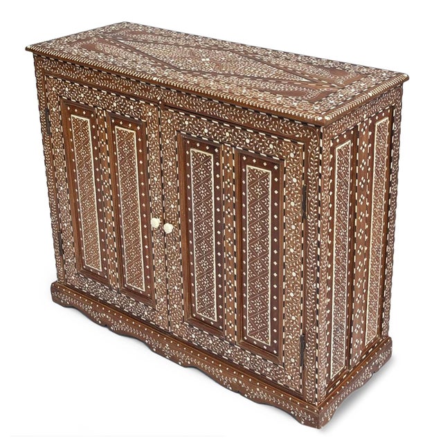 Vintage Indian teak wood inlay sideboard or storage cabinet. Every visible surface is richly decorated with intricate...