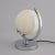 H: 25cm w: 21cm d: 15.5cm a british art deco table lamp with a central mottled glass globe shade and a chrome half-moon...