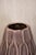 Decorative glazed ceramic vase from the 1970s, in taupe tones. Featuring an elongated, tapered form and a raised surface...