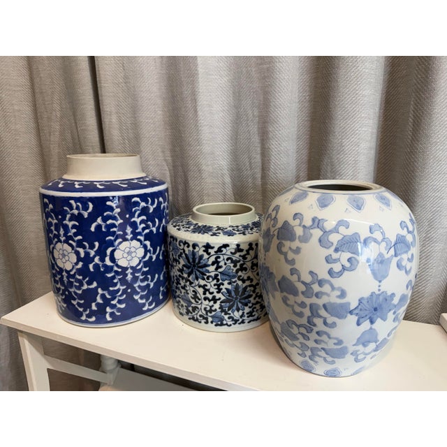 Vintage 1980s blue and white Export mismatched set of three vases. Hand painted with botanical motif. Ideal for flower...