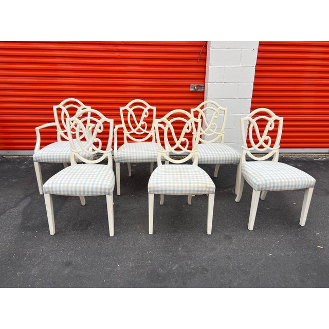 This set of six vintage Hollywood Regency dining chairs from the 1980s have great openwork backs with interlocking scroll...