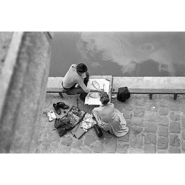 Maurice Bonnel Artist and his admirer, quai Saint-Michel 1954 Warmtone barium silver photograph on Ilford paper Signed and...