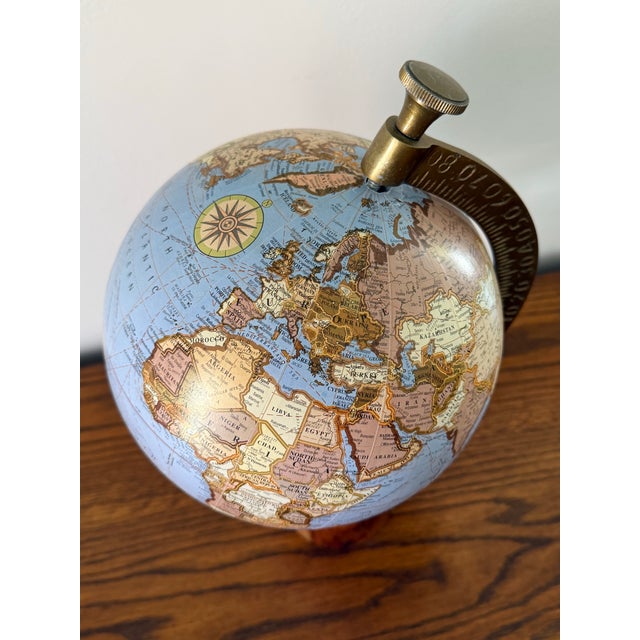 Handsome Contemporary blue globe with a solid brass meridian. Stands on a conical wooden base. Please see dimensions and...