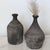 Weathered antique handcrafted clay vase. Hand-thrown vases were made and shaped by hand and fired in a wood-burning kiln,...