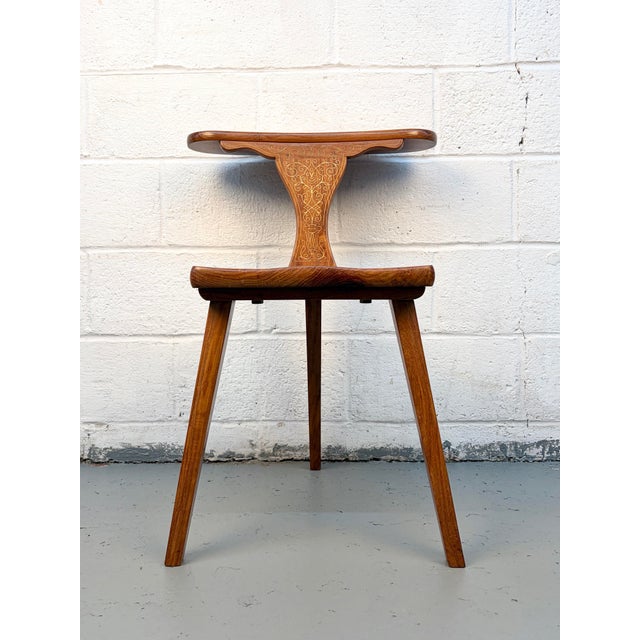 A striking example of Mid-Century Modern design with a Brutalist edge, this three-legged chair (often referred to as a...