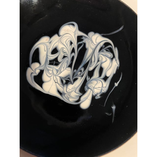 MCM round black and white enameled copper dish. Signed on the back by artist Peg Weber. 4.25 inche diameter, this...