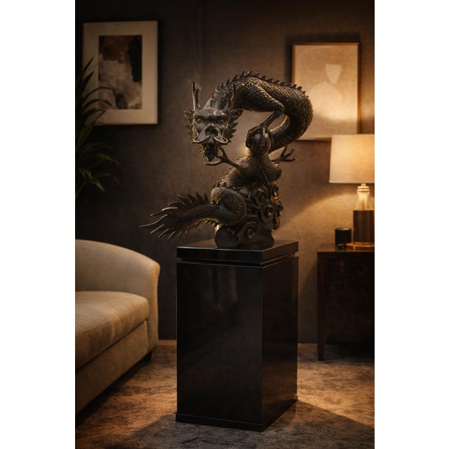 This monumental Asian-style dragon sculpture is an impressive decorative statement piece featuring a highly detailed...