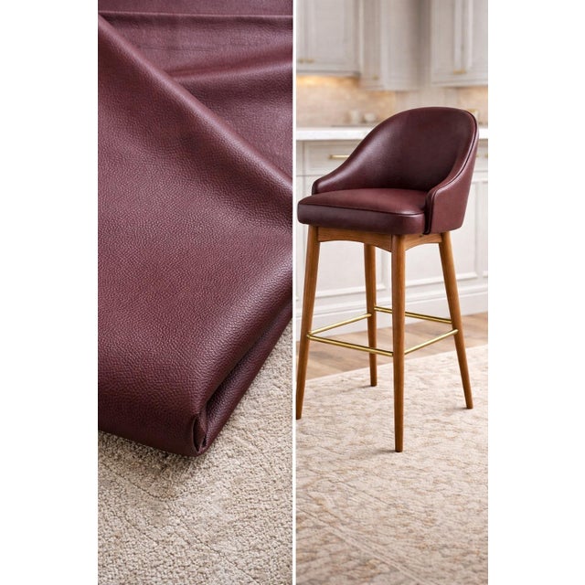 Luxurious Knoll Textiles merlot pebble-grain faux leather upholstery vinyl, shown here upholstered on bar stools to...