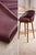 Luxurious Knoll Textiles merlot pebble-grain faux leather upholstery vinyl, shown here upholstered on bar stools to...