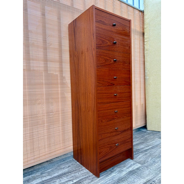Vintage Mid Century Danish Modern Teak Highboy / Lingerie Chest of Drawers. Circa 1970s Features a sleek Mid Century...