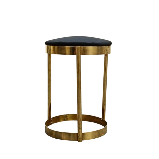 Design Stool in Metal and Fabric. The structure is made of solid doratpo metal with a mirror finish. The circular seat is...