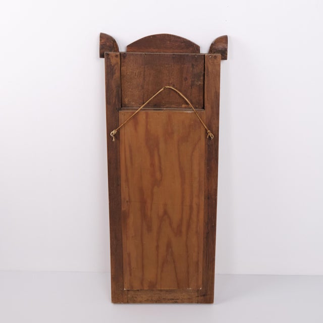 Mirror crafted in light mahogany with decorative columns and gilt details. Dating from the 1860s, it features classic...