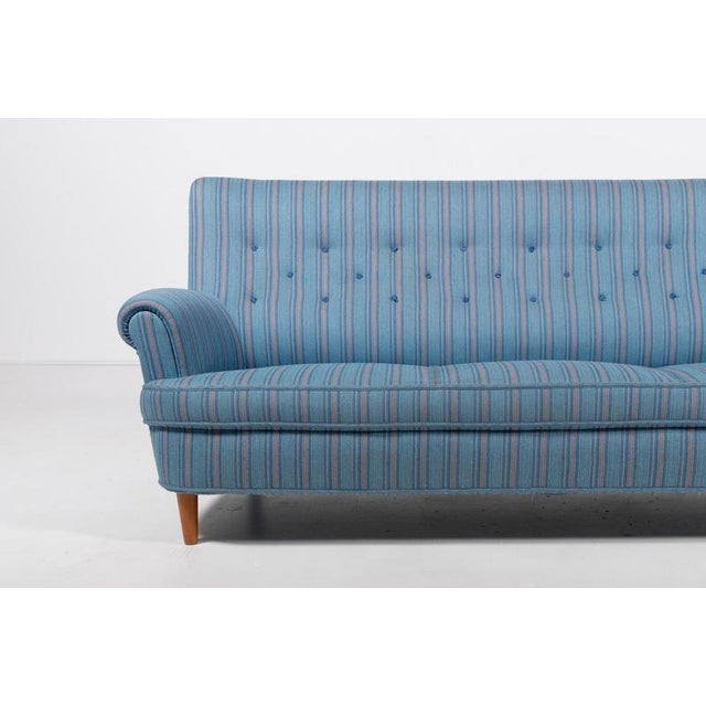 Swedish Modern three seats sofa model ‘Home evening’ from Scandinavian modernist Carl Malmsten. 1960s. The neat sofa was a...