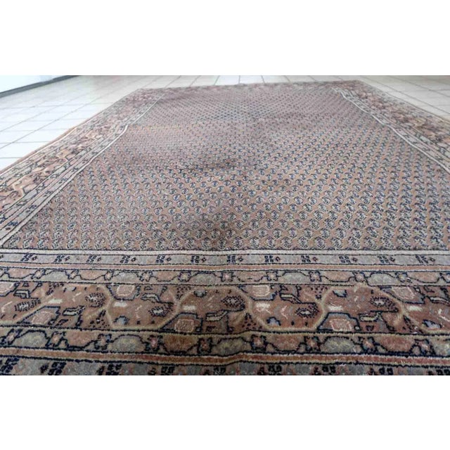 Handmade vintage Indian with Persian Seraband design in unusual brown color. The rug is from the end of 20th century in...