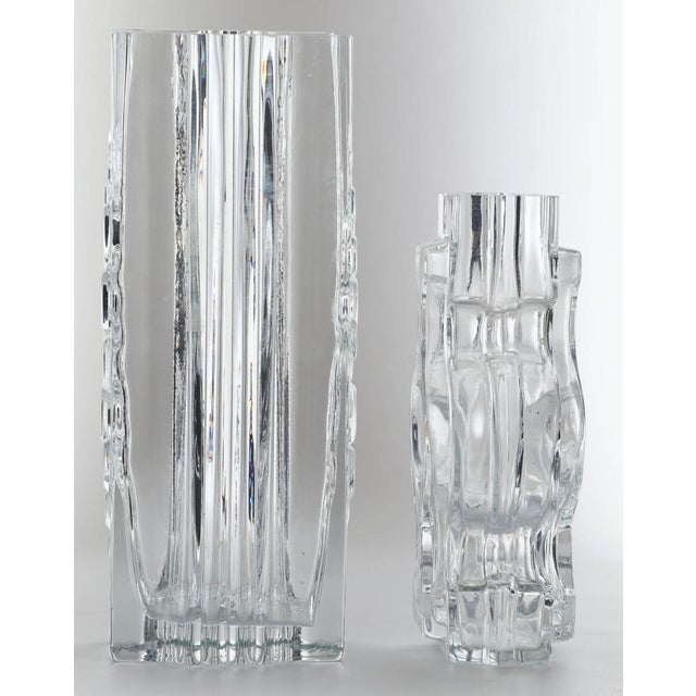 A set of two pieces of glass objects produced by Riihimäen Lasi, a prominent Finnish glass factory founded in 1910 and one...