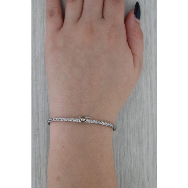 Metal: 18k White Gold, Yellow Gold Clasp Weight: 6.8 Grams Stamps: 18kt Chain Style: Basketweave Pattern Closure: Snap &...