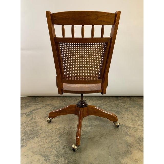 Vintage MidCentury Modern Cane Back Rolling Swivel Bankers Chair