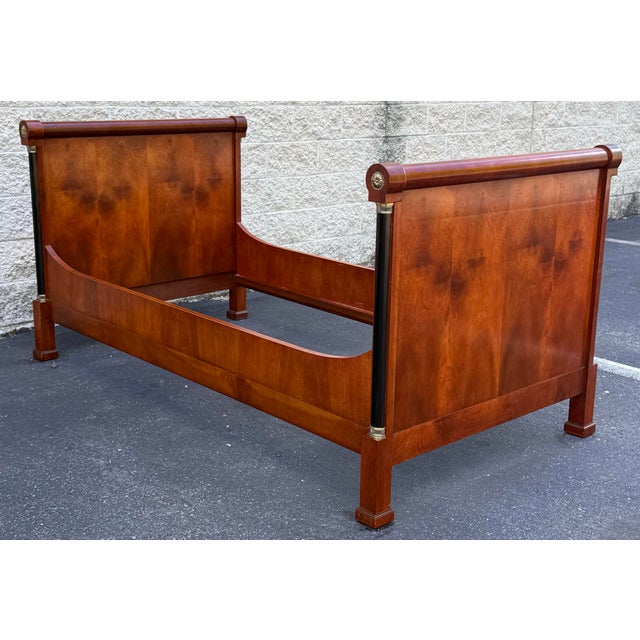 Stunning flamed Mahogany woodgrain is the star, the subtle curves, black columns, rosettes and gilt details add the...