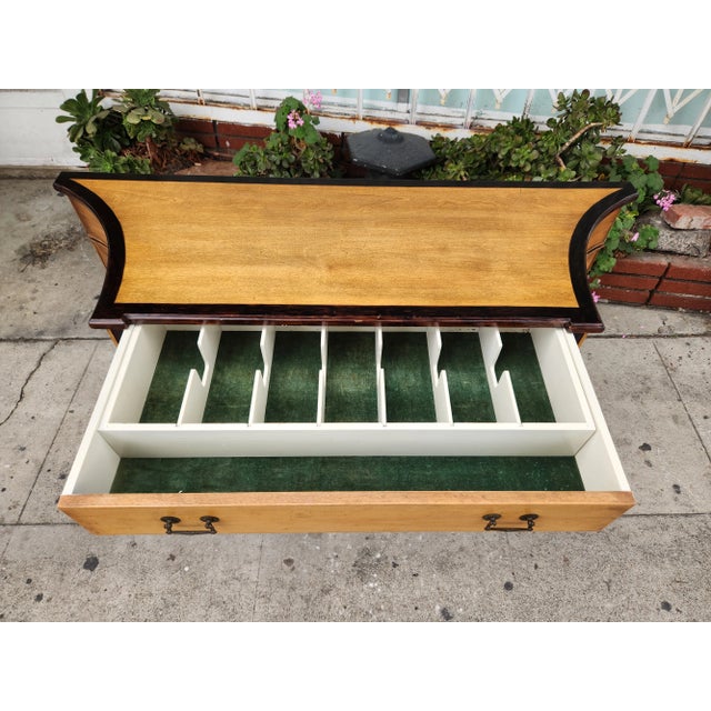1950s buffet with adjustable bottom shelves. The buffet is sturdy and has cabinets to organize utensils.
