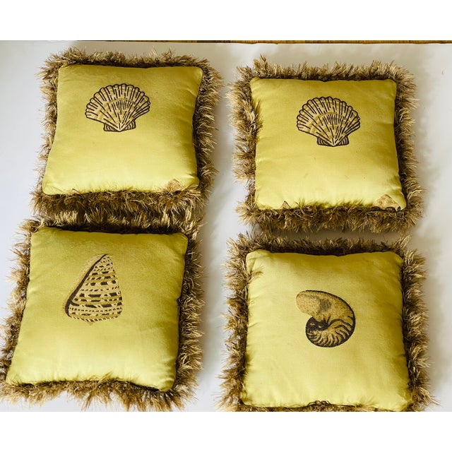 Set of 4 lovely 15” throw pillows with embroidered sea shells and fringes around.