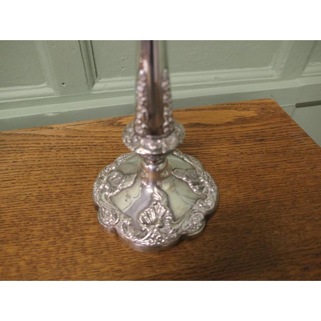 A Pair of 19th Century Silver Plated Candle Sticks The Candle sticks are very decorative they have lift-out drip pans and...