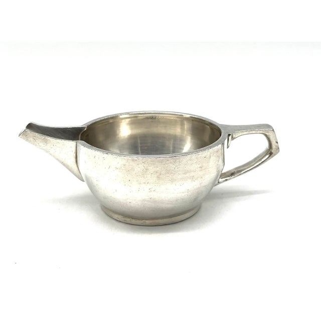 A compact silver-plated pitcher by Gebrüder Hepp of Pforzheim, manufactured for P. Welter. Its classic shape and robust...