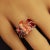 Introducing a bold and breathtaking Brazilian Imperial Topaz and Garnet Dinner Ring, a true statement piece that combines...