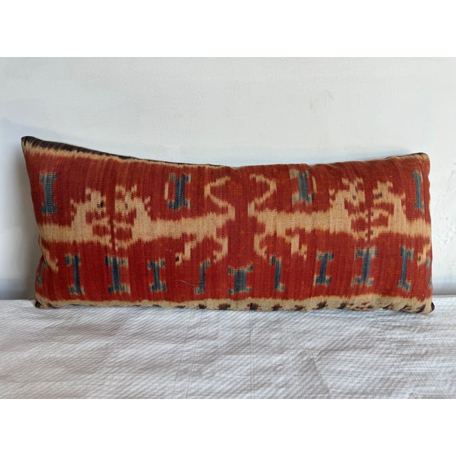 Make a statement with this exquisite 1850 Ikat pillow, featuring a rare and vibrant design inspired by traditional...