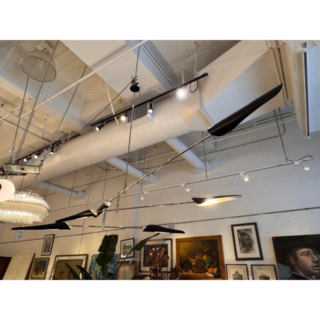 Design Plus Gallery presents a Sarus Mobile Chandelier No. 428 by David Weeks Studio. This modern ceiling fixture reflects...