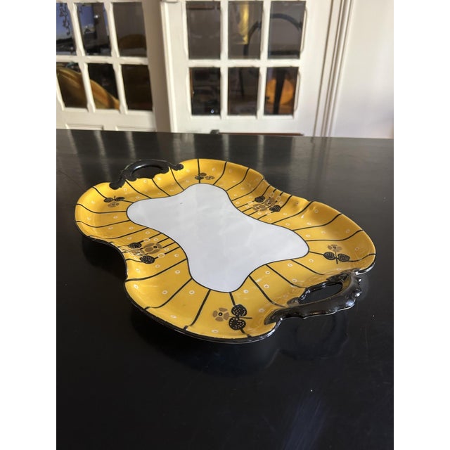 A rare porcelain dish signed by Douze, Lemaitre Frères, and L. Blancher, a manufacturer specializing in tableware....
