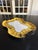 A rare porcelain dish signed by Douze, Lemaitre Frères, and L. Blancher, a manufacturer specializing in tableware....