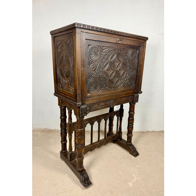 Impressive Spanish cabinet on stand or bargueño dating from the 20th century, crafted in wood and richly carved...